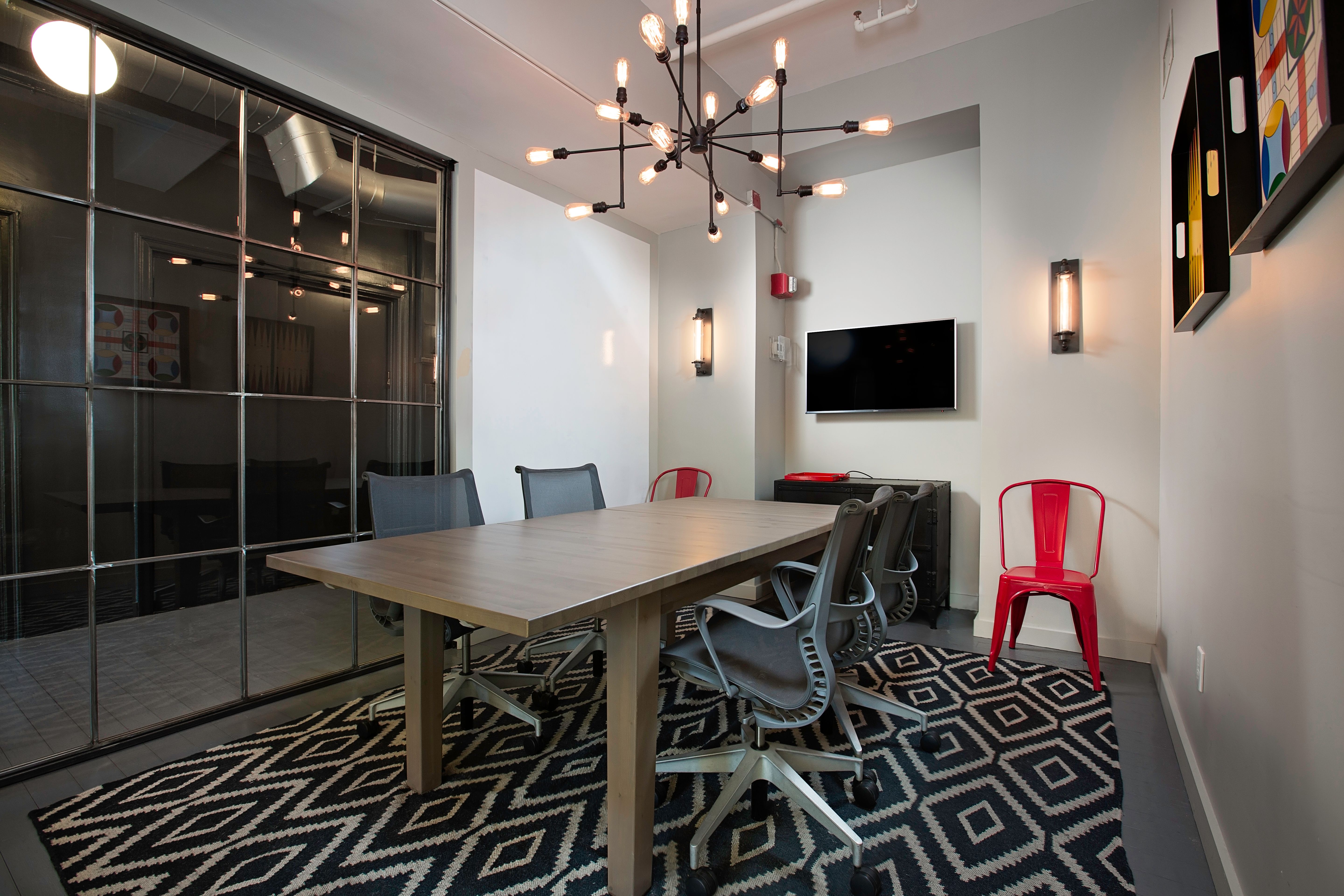 Stylish Meeting Room Space with TV - View 1
